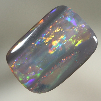 SOLID SEMI BLACK OPAL Fire display showing bands of colour 